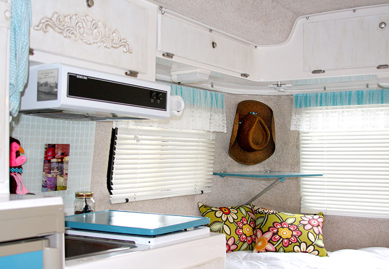 Casita Travel Trailer Interior Makeover - TV stand, hat hook, kitchen and cabinets.
