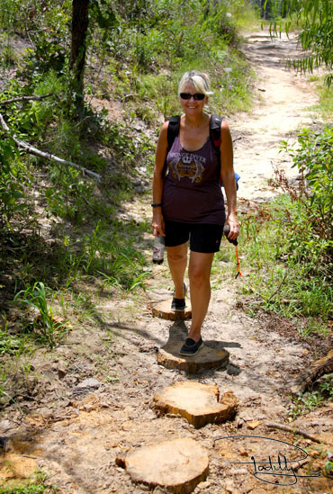 Woman hiking Bastrop State Park's Red Trail