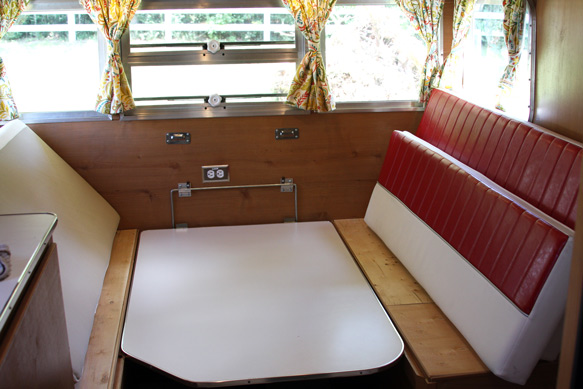 Shasta Trailer Dinette Being Converted to Bed by Mrs. Padilly