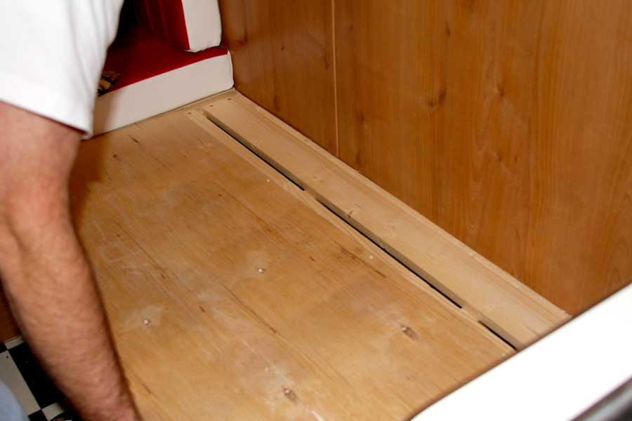 Placing plywood on wood seat supports in Shasta
